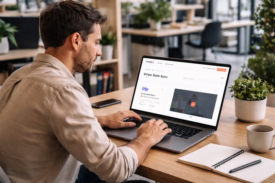 HubSpot CRM and Stripe billing systems connected through a central data hub, with flowing data lines between sales pipeline, invoices, subscriptions, and payments, clean UI, blue and purple tones, futuristic but minimal, visualizing a unified revenue system and real-time financial visibility