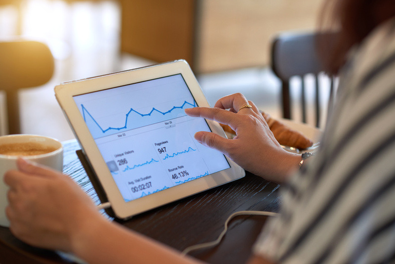 Tablet shows graph with website pageviews and performance reports