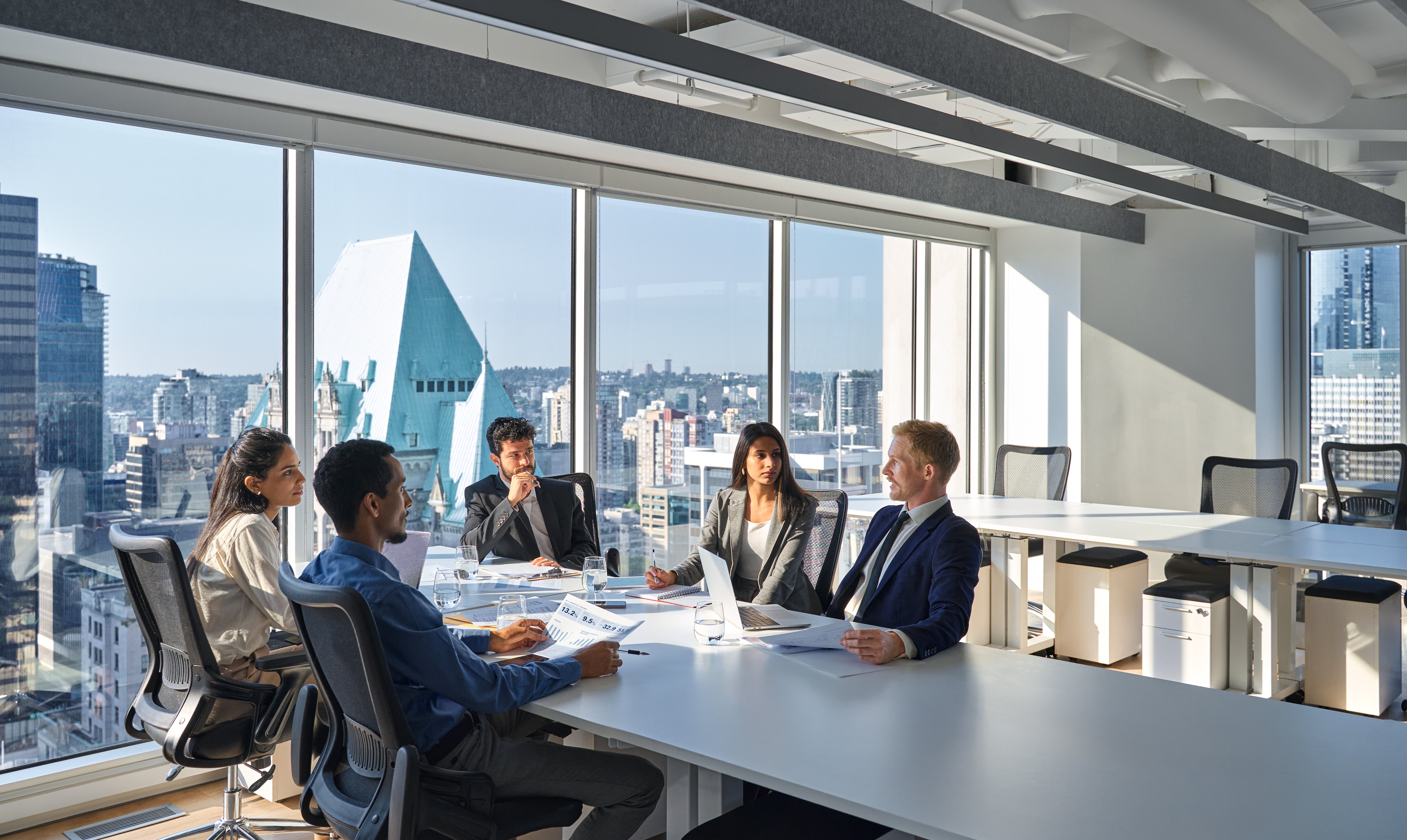 busy-diverse-board-executives-team-people-working-2023-11-27-05-10-48-utc