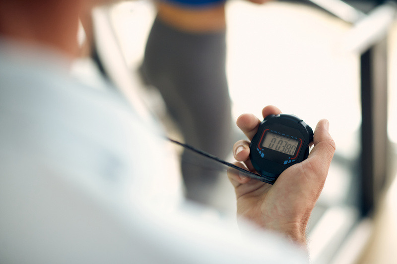 Person uses a stopwatch to track time