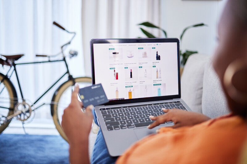 Person shopping online after following an online advertisement