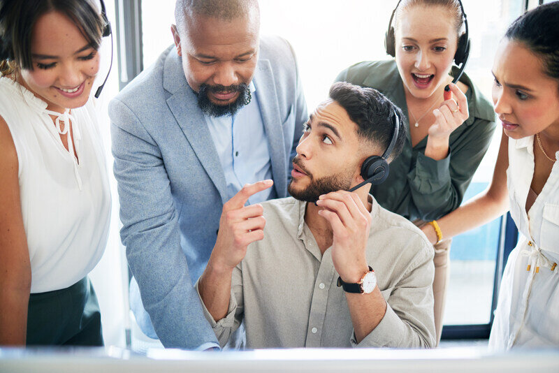 Sales team listening in on a call while a deal is made